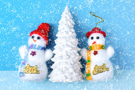 Snowman and Winter landscape with paper art style and pastel colorの写真素材