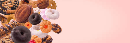 mix of cookies over pink background, panoramic mock upの写真素材
