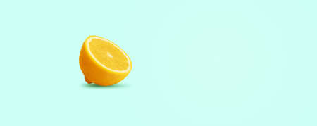sliced lemon on blue background, panoramic image with space for textの写真素材