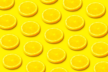 Lemon slice pattern on yellow backgroundの写真素材