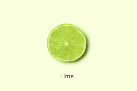 slice of lime over yellow background, minimalism fruit concept