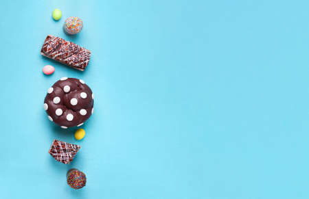 easter cakes on blue background, mock-up with space for textの写真素材