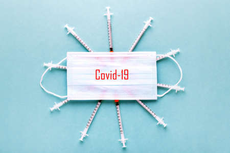 medical mask and syringes, Coronavirus Covid-19 conceptの写真素材