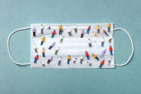 human figures on medical protective mask, virus protection concept, mock-up image