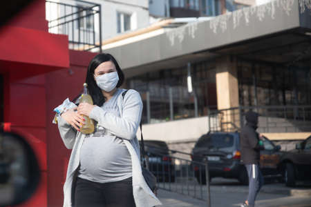 18 march 2020 unidentified pregnant woman in medical protective mask, coronavirus (covid-19) ...