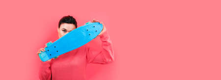 girl with skateboard over pink background, panoramic mock-up with space for text