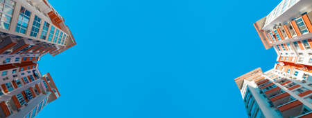 view of the building residential complexes against the blue sky, panoramic mock-up imageの写真素材