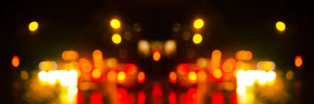 Colorful defocused bokeh lights background. City glare abstract background.