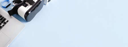 laptop, vr, ip camera and smart watches on blue background, mock up for new technologiesの写真素材