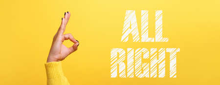 hand ok sign with all right inscription over trendy yellow background, panoramic image