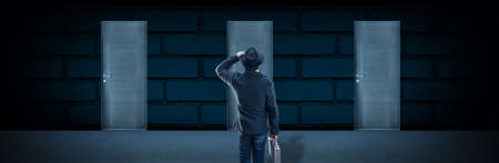 a man in a hat stands in front of doors, the concept choosing the right door, panoramic image
