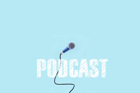 podcast inscription over levitating microphone, image on  azure backgroundの写真素材