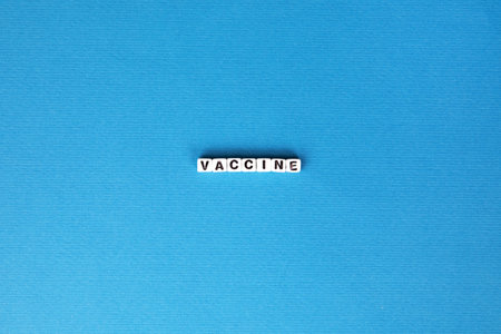 vaccine inscription on blue backgroundの写真素材