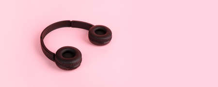 black headphones over pink background, music and sound concept, panoramic imageの写真素材