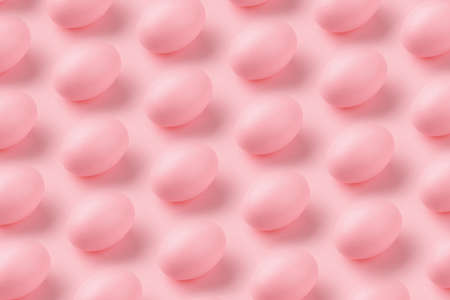 Pattern made of eggs on pastel pink background, minimal easter concept