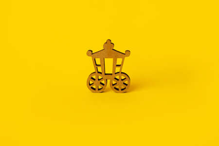 wooden vintage carriage over yellow background, vintage transportの写真素材