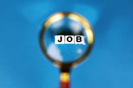 magnifying glass with job inscription, search job conceptの写真素材