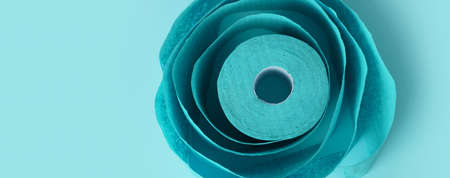 Roll of toilet paper on blue background, panoramic imageの写真素材