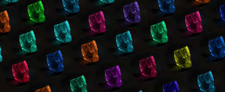 pattern of precious multi-colored stones over dark background, jewelry concept, panoramic imageの写真素材