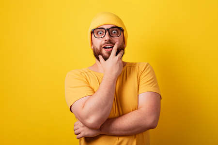 thinking man over yellow background, guy came up with a solution to the problemの写真素材