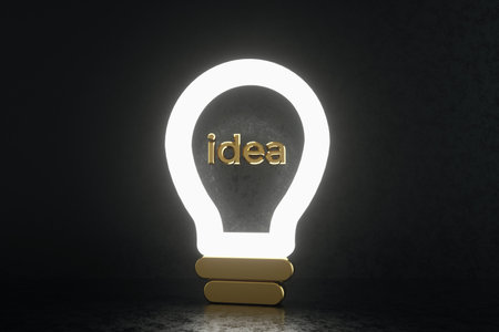 light bulb and golden idea inscription over black background, 3d renderの写真素材