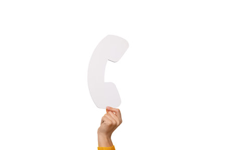 symbol of telephone receiver in hand isolated on white background, communication conceptの写真素材