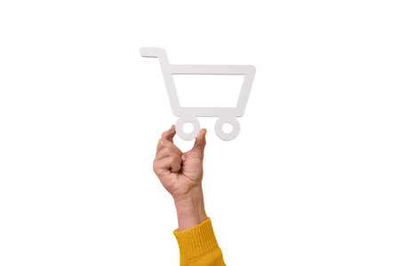 shopping cart symbol in hand isolated on white background