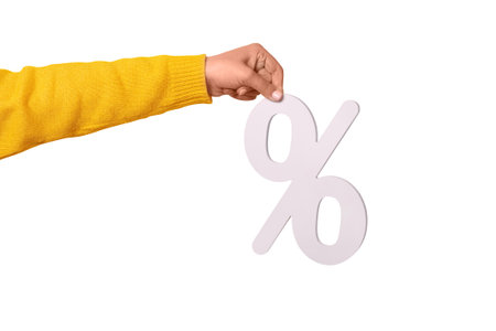 Woman hand holding 3D  white percentage sign isolated on white backgroundの写真素材