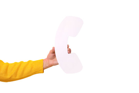 Hand holding symbol of telephone receiver isolated on white background, communication conceptの写真素材