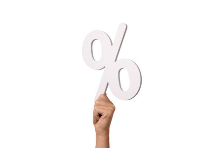 hand holding percentage sign isolated on white backgroundの写真素材