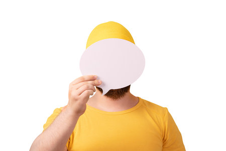 unidentified man holding speech bubble with empty space for text isolated on white backgroundの写真素材