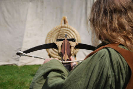 crossbow archer shooting on targetの写真素材
