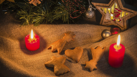 Tasty homemade Christmas cookies with red candles, closeup viewの写真素材
