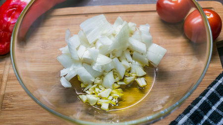 Top view of raw cuting onion on glass bowl, prepared for cookingの写真素材
