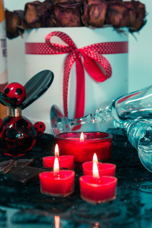 valentine background of wine, chocolate and red candlesの写真素材