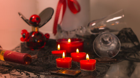valentine background of wine, chocolate and red candlesの写真素材