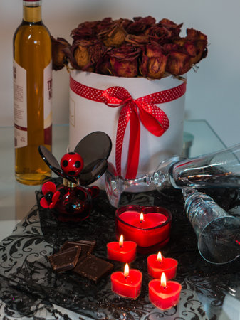 valentine background of wine, chocolate and red candlesの写真素材