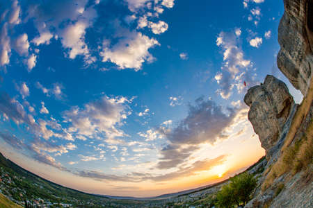 360 degree panoramic landscape of blue sunset sky and rocks.