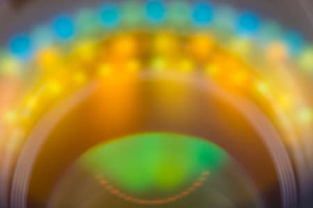 Vivid bright colored abstract background with blurred circule shaped  light spots.の写真素材