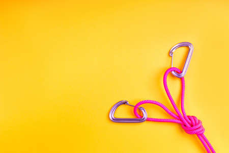 Double Figure 8 Knot and two carbines on background .の写真素材