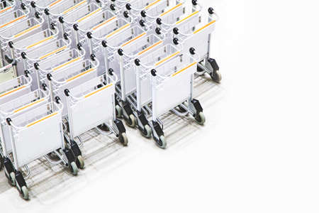 Long lines of luggage trolleys in the airport, upper view.の写真素材