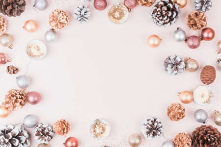 New year composition made of christmas balls, trees, and many different knick knacks on a light background. Flat lay style.の写真素材