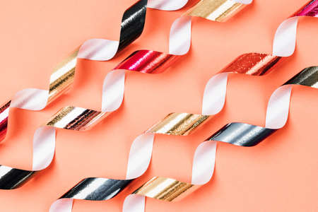 Colorful festive spiral ribbon on a background.の写真素材