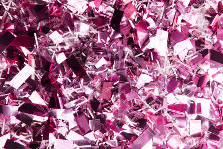 Glittering purple confetti background. Festive background for projects.の写真素材