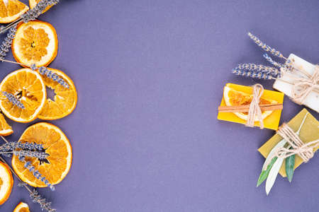 Organic natural set made of olive, lavender and orange pieces of soap packed with dried lavender and olive herbs and orange slice. Organic spa set.の写真素材