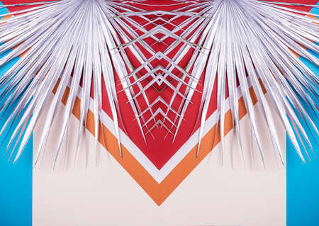Silver shining palm branch on a colorful geomitric background. Style of 1920th years  in modern update.の写真素材