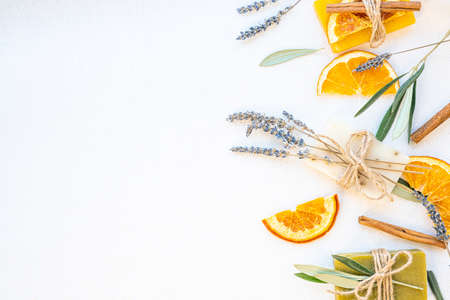 Organic natural set made of olive, lavender and orange pieces of soap, cinnamom sticks and dried herbs. Organic spa set.の写真素材
