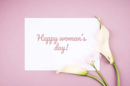 Flower card made of white calla flowers  with white blank paper in the cennter. For holiday project.