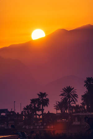 Beautiful sunset on the beach of Mediterranean sea, Antalya, Turkey.の写真素材