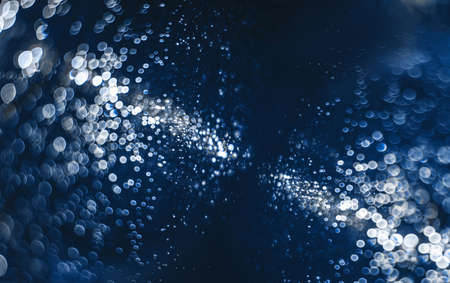 Abstract water drops background toned with classic blue trend color 2020.の写真素材